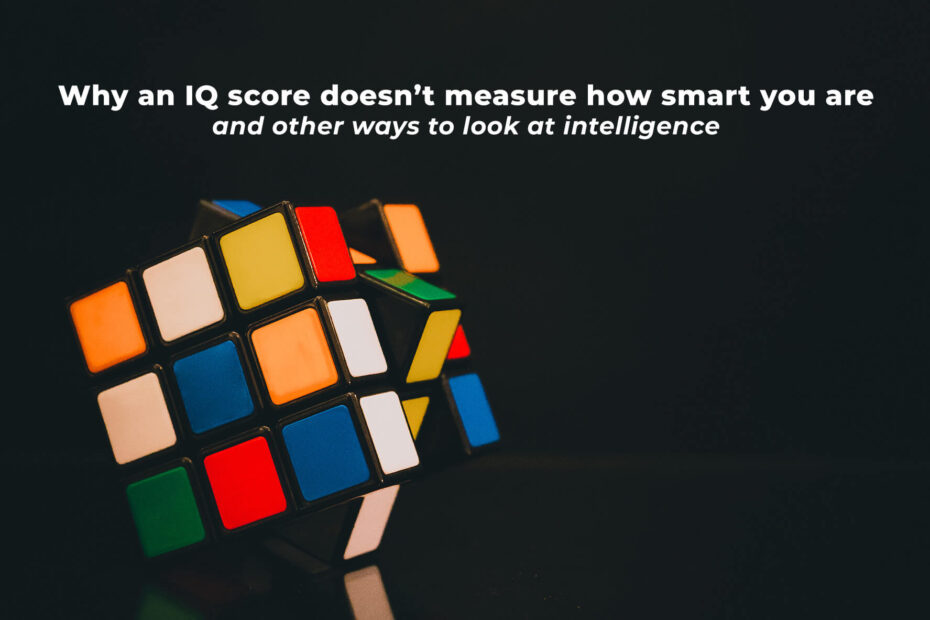 A three by three rubiks cube with a dark background. Above it is written in white: why an I.Q. score doesn't measure how smart you are and other ways to look at intelligence.